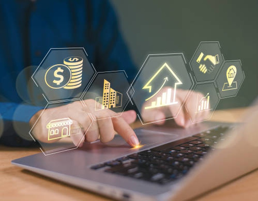 Financial data and structuring icons overlaying a hand at a laptop, representing Amaltheia Capital's bespoke funding structures